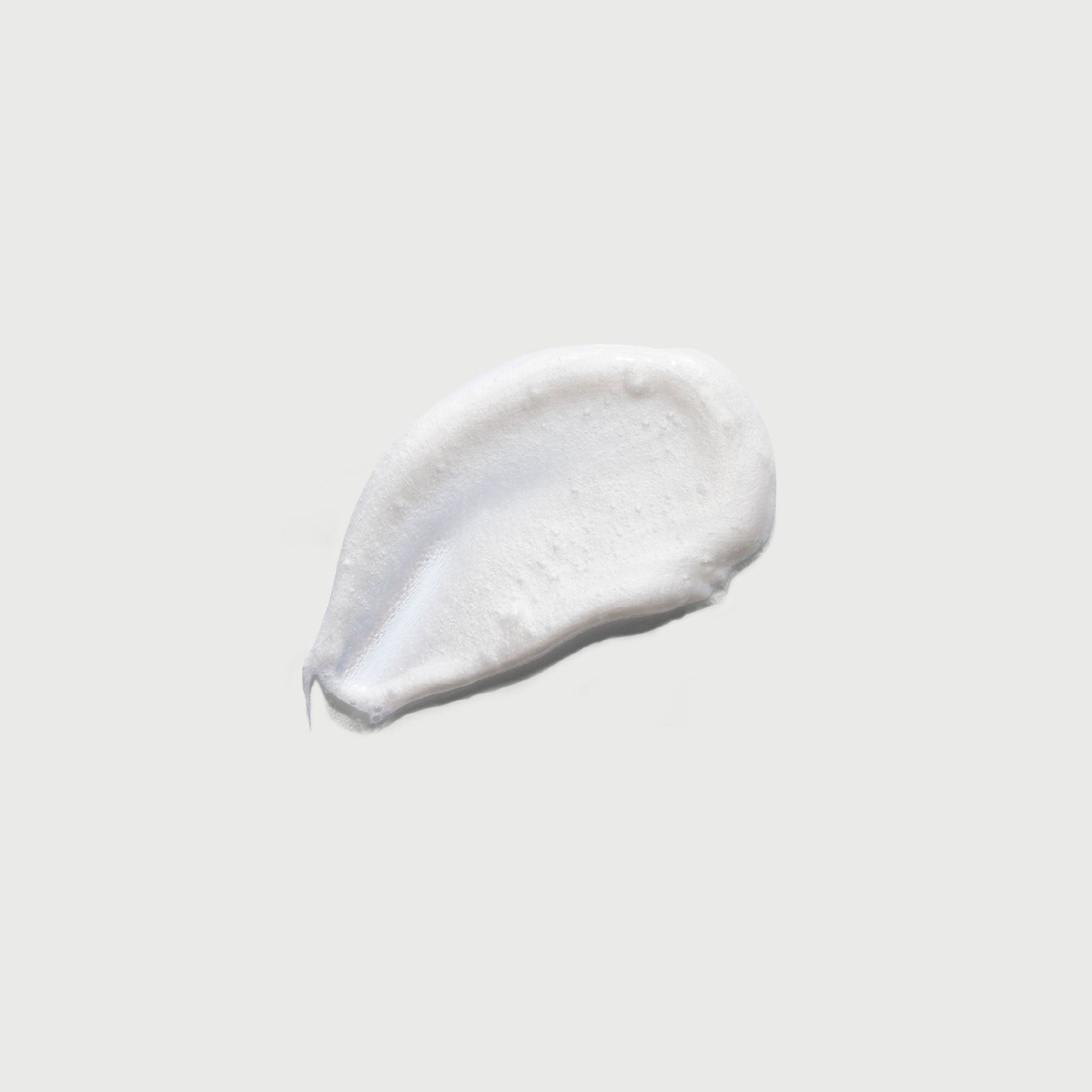 the-smoother-glycolic-acid-exfoliating-body-wash-r4 NATR-40002-Swatch-The-Smoother-Glycolic-Acid-Exfoliating-Body-Wash-bonebkgd.jpg