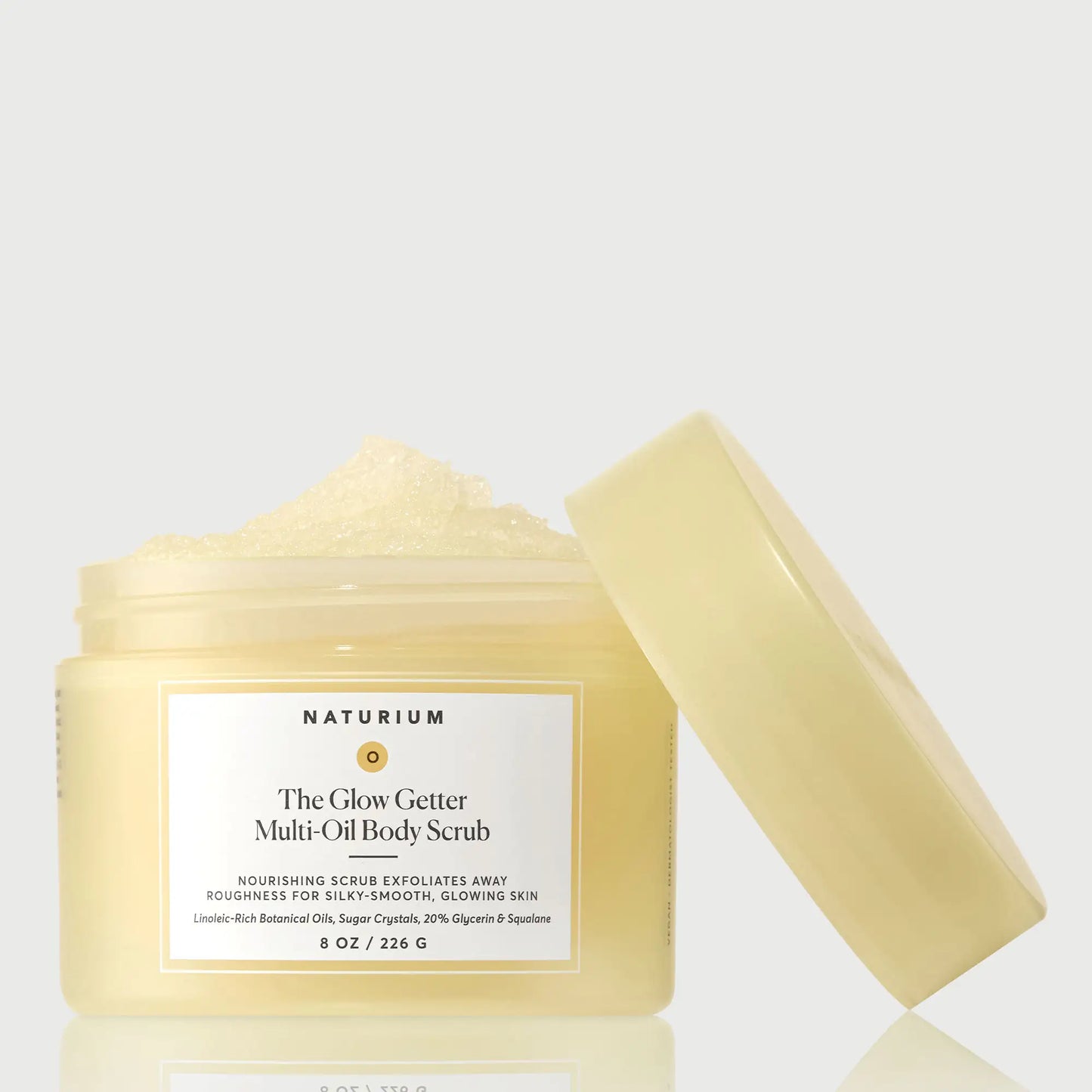 the-glow-getter-multi-oil-body-scrub-i1 NATR-40028-GlowGetter-Multi-Oil-Body-Scrub-Front-CapOff-bonebkgd.webp