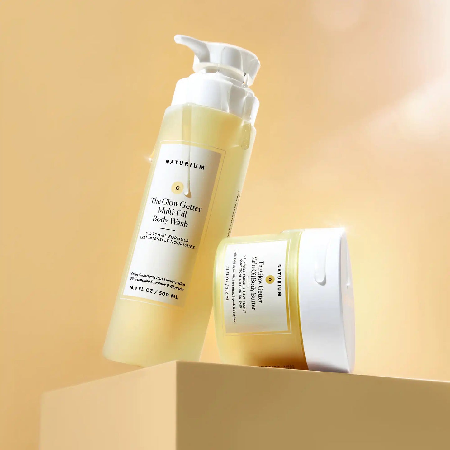 the-glow-all-out-body-bundle-c4 gg-bodybutter_1464-crop_revcolor_FL.webp